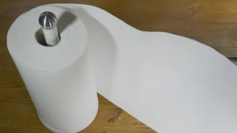 Pulling on kitchen towel roll. Stock Footage 141790599