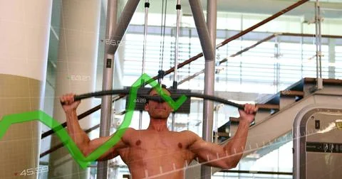 Pulling lat pulldown bar, shirtless man engaging back muscles at gym, showing Stock Photos