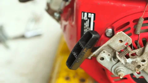 Pulling a Lawn Mower Cord Video stock 64109181