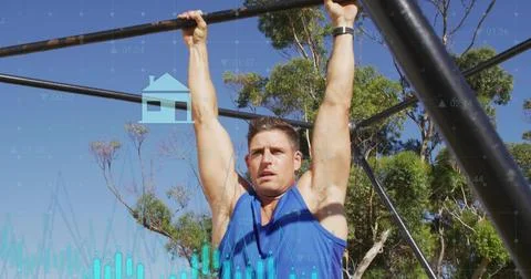 Pulling man gripping pull-up bars at park, wearing blue sleeveless top, watch, Stock Photos