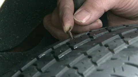 Pulling Nail from Car Tire Stock-Footage 305163