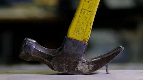 Pulling a nail with a claw hammer Stock Footage 139015731