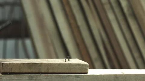 Pulling nails from wood plank with hammer Video stock 95176518