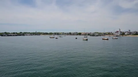 Pulling into a New England harbor on a partly cloudy day 스톡 동영상 59712181