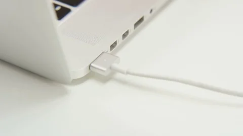 Pulling Out a Cable From a Computer Stock Footage 70988926