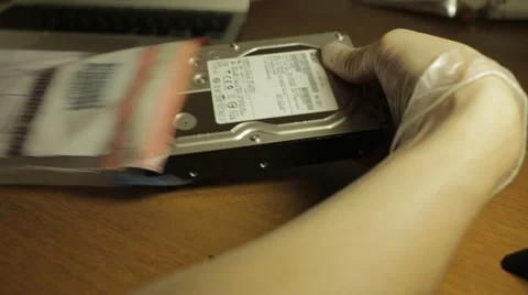 Pulling Out Computer Hard Drive of Police Bag 스톡 동영상 65179175