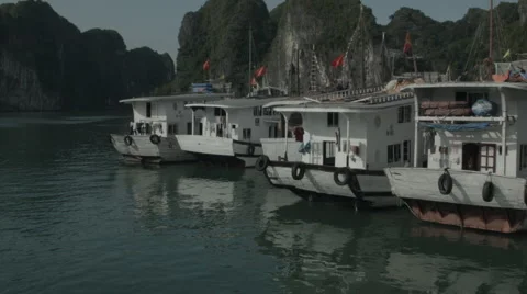 Pulling out of dock in the middle of Ha Long Bay Vietnam Stock-Footage 48053618