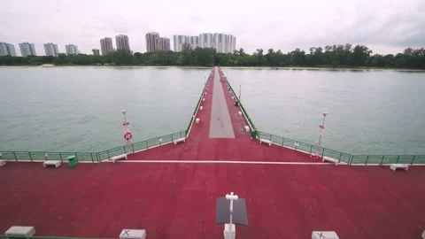 Pulling out drone shot of Bedok jetty, Singapore Stock Footage 211363502