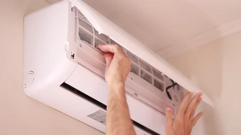 Pulling out filter from air conditioner Stock Footage 95319067