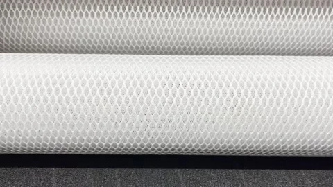 Pulling out the knitted fabric in the knitting machine Stock Footage 239646150