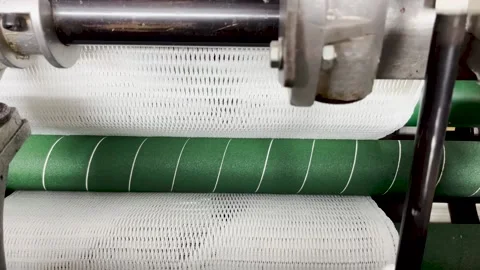 Pulling out the knitted fabric in the knitting machine Stock Footage 239646512