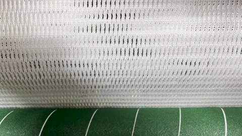 Pulling out the knitted fabric in the knitting machine Stock Footage 263364026