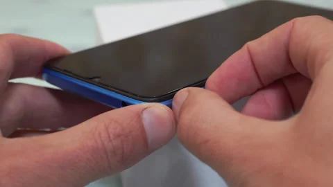 Pulling Out The Phone Sim Card Tray From The Smartphone Video stock 268850642