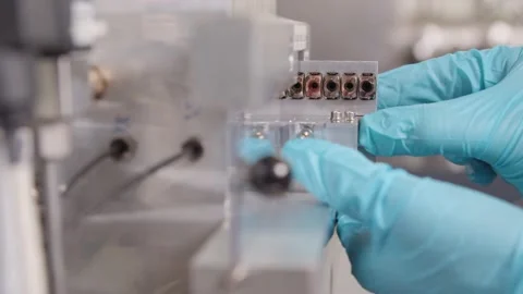 Pulling out Samples from Examination / Research Vídeos de archivo 145055854