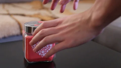 Pulling out sticky note from a love glass jar with I love you caption Video stock 121508691