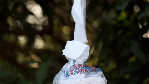 Pulling out tissues from the tissue packet Stock Footage 148551090