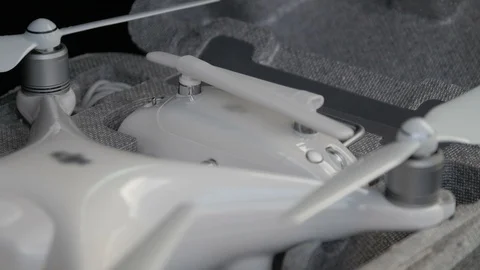 Pulling out a white remote control from a black backpack Stock Footage 88334488