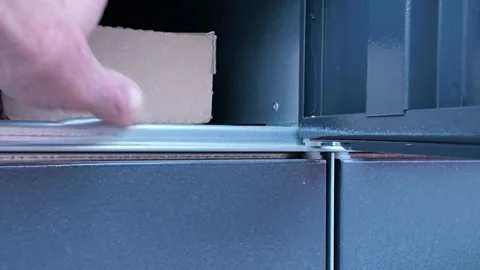 Pulling the package from the self-service pick-up point. The concept of Stock Footage 274724633