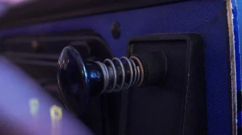 Pulling pinball plunger back and letting go 4k Stock Footage 51776751