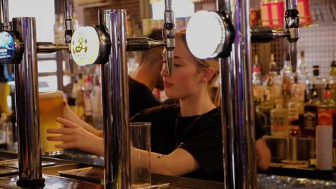 Pulling pints. Drinking alcohol in pub. Leeds.UK 6.7.2024 Stock Footage 288698063