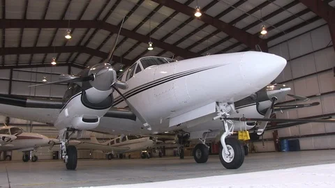 Pulling Plane Out of Hangar Low Angle 스톡 동영상 102133819