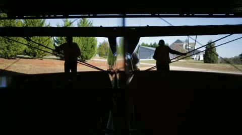 Pulling a plane outside Stock Footage 22100267