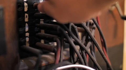 Pulling plug from socket of retro telephone exchange Video stock 119614088