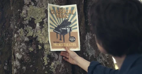 Pulling Poster Off A Tree 動画素材 285153374