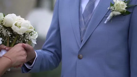 Pulling on a ring on a groom Stock Footage 232763768