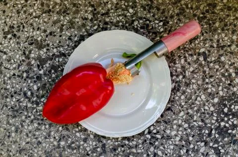 Pulling seeds of red, raw,  ripe  peppers, paprika or Capsicum Stock Photos