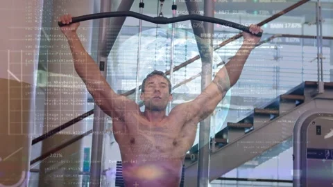 Pulling shirtless man performing lat pulldown at gym, cable machine wide bar Stock Footage 331615299