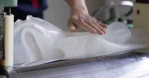 Pulling Silicone Rubber from Mixing Machine Stock Footage 73070498