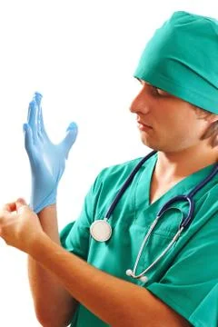 Pulling on surgical glove Stock Photos