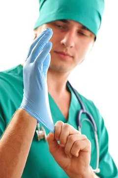 Pulling on surgical glove Stock Photos