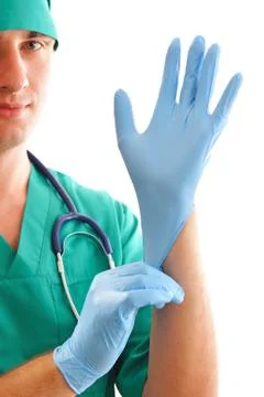 Pulling on surgical glove Stock Photos