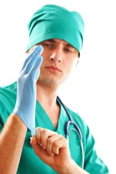 Pulling on surgical glove Stock Photos