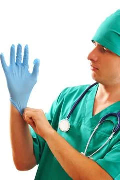 Pulling on surgical glove Stock Photos