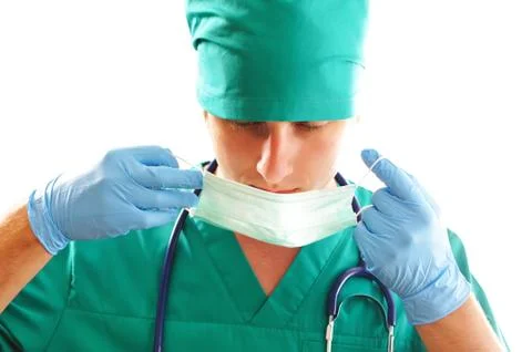 Pulling on surgical mask Stock Photos