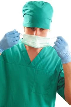 Pulling on surgical mask Stock Photos