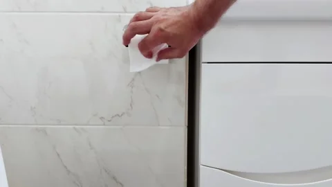 Pulling Toilet Paper in Soft Marble Light: A Simple Daily Motion 스톡 동영상 313863108