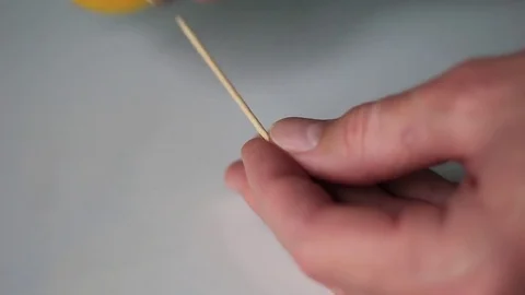Pulling a toothpick out from a box Видео 71953476