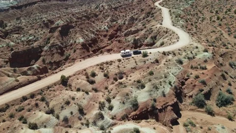 Pulling travel trailer through the desert. Aerial shot Video stock 169545896