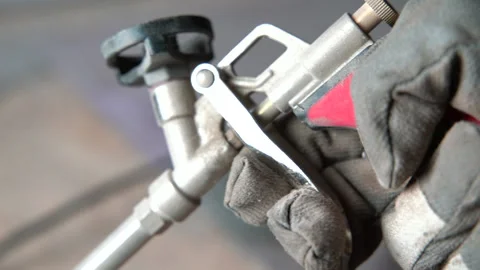 Pulling trigger on foam gun Stock Footage 161165220