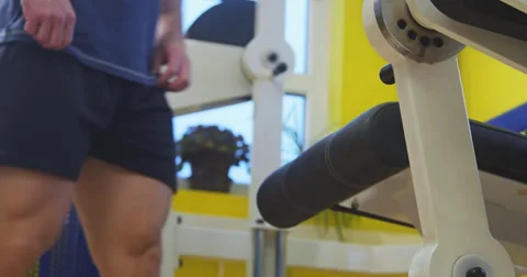 Pulling weight machine at gym Stock-Footage 38732575