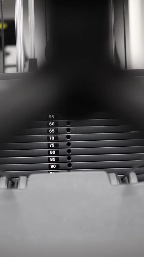 Pulling weight stack during workout Stock Footage 337346312