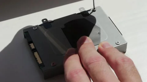 Pulling winchester out from a laptop Stock Footage 66756072