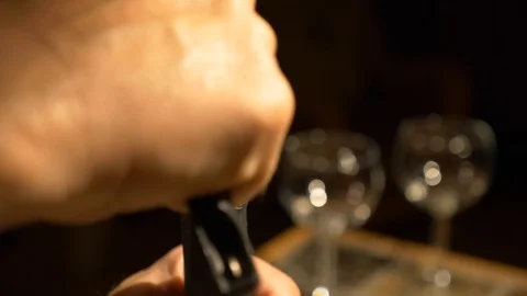Pulling a wine cork on a romantic evening Stock Footage 87462713