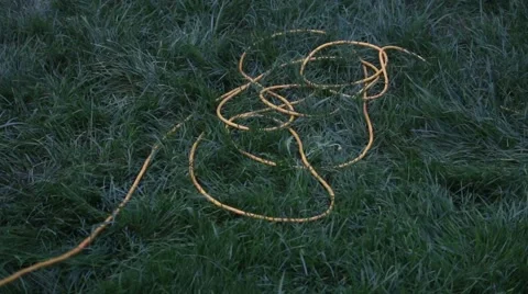 Pulling a Yellow Extension Cord Stock Footage