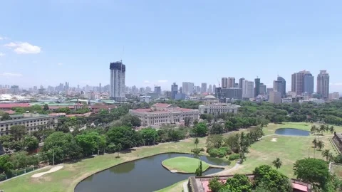 PULLOUT AERIAL SHOT OF MANILA FROM INSIDE INTRAMUROS Stock Footage 130863169