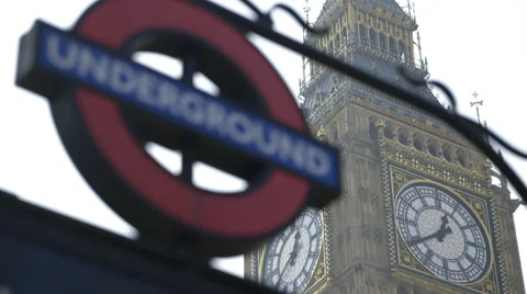 Pull/Rack focus from Big Ben Clock (Elizabeth Tower) to London Underground sign Video stock 36146391
